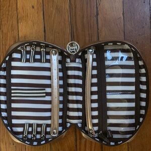 henri bendel Gold Rectangular travel Jewelry clutch.